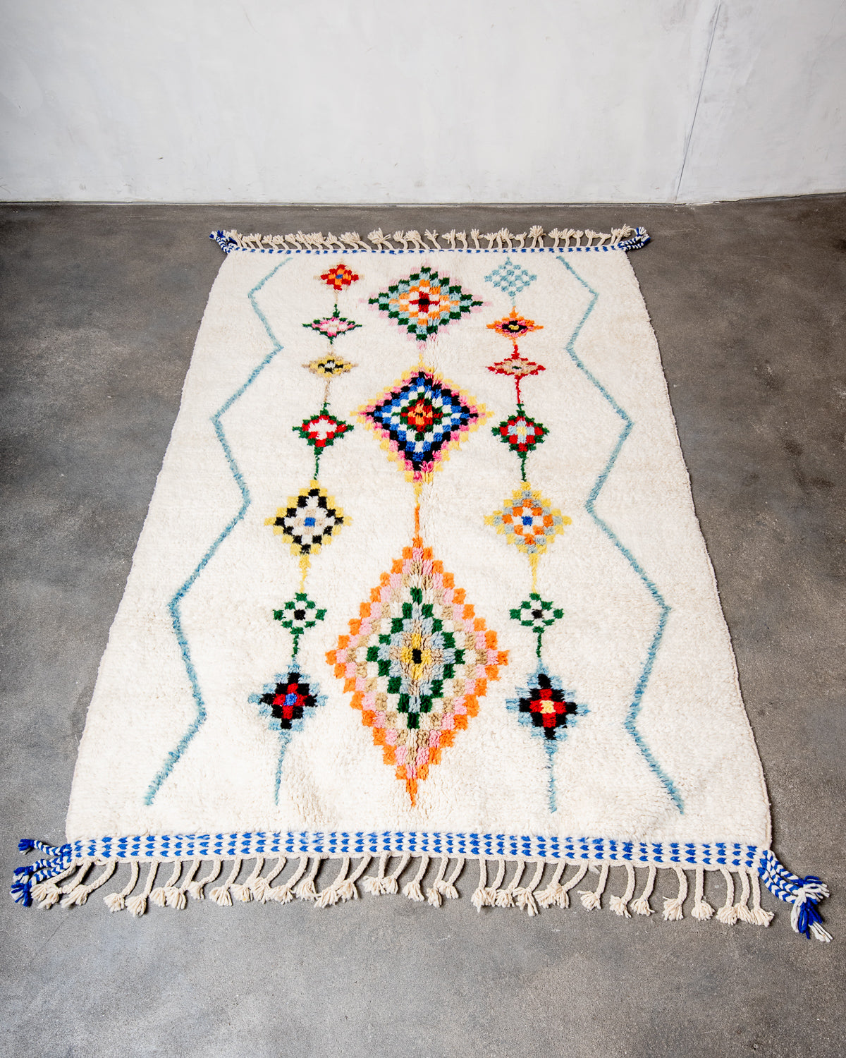 Modern, designer, handcrafted Berber rug from Morocco. Beniourain carpet with beautiful colours and patterns and fluffy wool texture.